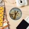 Cute magnet design of a giraffe in a hearing checkup scene with helpful birds.